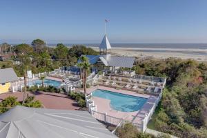 an aerial view of a resort with two pools and lounges at True Knot Cottage in Saint Simons Island