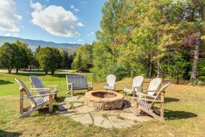 a group of chairs sitting around a fire pit at Bridges 61 in Sugarbush Village