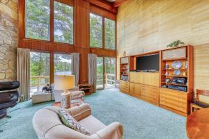 a living room with wood paneled walls and a television at Private Contemporary in Chestertown