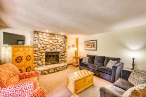 a living room with a couch and a fireplace at Robbers Nest in Breckenridge