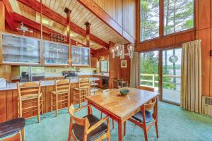 a large kitchen with a wooden table and chairs at Private Contemporary in Chestertown