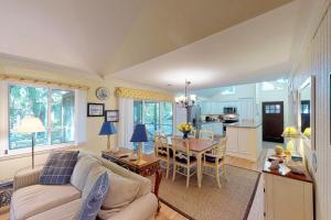 a living room with a couch and a table at Oceanwoods 443 in Kiawah Island
