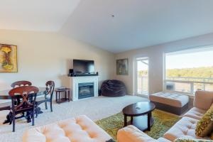 a living room with a couch and a table at Lighthouse Views in Westport