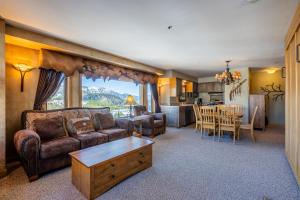 a living room with a couch and a table at Shoshone 1954 in Big Sky