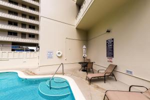 a swimming pool in a hotel room with a swimming pool at Harbor View Plaza #1203 in Honolulu