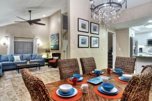 a dining room and living room with a table and chairs at North Beach C in San Clemente
