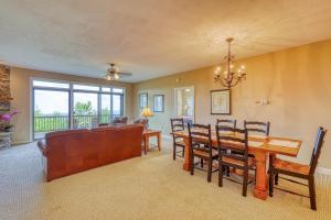 a dining room and living room with a table and chairs at Reserve 02-D in Sugar Mountain