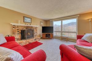 a living room with a fireplace and a tv at 116 Red Ridge Lane in Conway