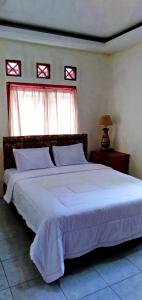 Una cama o camas en una habitación de Resort Highlander