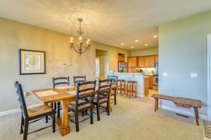 a dining room and kitchen with a table and chairs at Reserve 02-D in Sugar Mountain