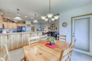 a kitchen and dining room with a wooden table and chairs at Lookout Ridge 63 in Dillon