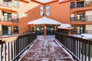 a walkway in front of a building in the snow at Forest Park 31E in Silverthorne