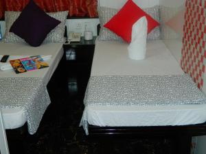Ένα ή περισσότερα κρεβάτια σε δωμάτιο στο Marrigold Hostel