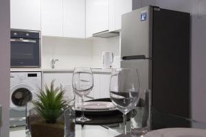 Кухня или мини-кухня в Corina Suites & Apartments

