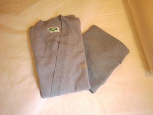 a brown shirt and tie sitting on a bed at Hotel Route-Inn Chiryu -Kokudou 1 Gou- in Chiryu +26 photos