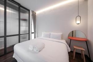 Postel nebo postele na pokoji v ubytování Wonderwall Hotel