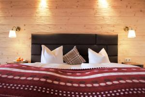 Giường trong phòng chung tại Hotel Berghof