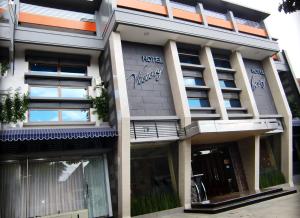 a building with graffiti on the side of it at Hotel Victory Bandung in Bandung