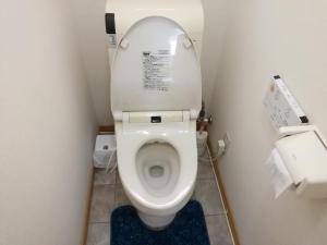 a small bathroom with a toilet with the lid up at Hakodate station 5minutes walk vacation stay in Hakodate