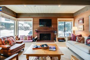 a living room with a couch and a fireplace at Dollar Meadows 1383 in Sun Valley