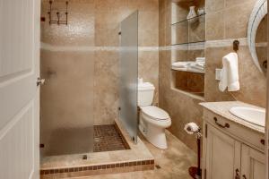 a bathroom with a shower and a toilet and a sink at Mesquite House Downstairs Unit in South Padre Island +21 photos