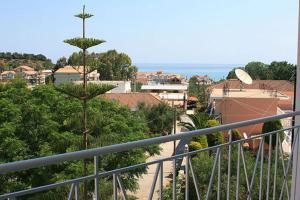 a view of a city from a balcony at Smile's Studios in Tsilivi