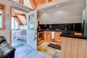 a kitchen with wooden cabinets and a counter top at Cabin in the Woods in Cabin Creek