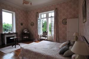 Ένα ή περισσότερα κρεβάτια σε δωμάτιο στο La Demeure d'Aglaë