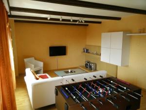 a kitchen with a stove top oven in a room at Fewo-Seefeld in Norderaussendeich