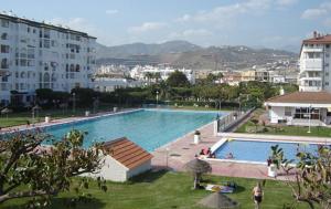 Bazén v ubytovaní Apto. Urbanización Laguna Beach, 1ª línea de playa alebo v jeho blízkosti