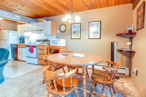 a kitchen and dining room with a table and chairs at Bay Point Lakefront 4A Down in Whitefish