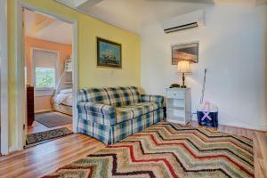 a living room with a couch and a rug at Plum Island Prize in Newburyport