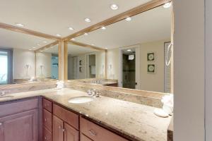 a bathroom with two sinks and a large mirror at Anna Maria Island Club Unit17S in Holmes Beach +38 photos