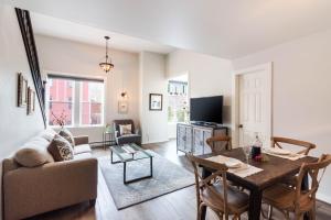 a living room with a table and a couch at Jarvis #301 in Durango