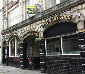 a store front of a baby groop on a city street at Harrington Suite in Liverpool