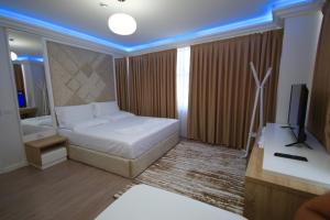 Postel nebo postele na pokoji v ubytování ELJOS HOTEL
