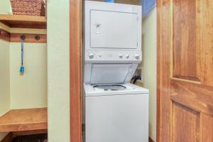 a white washer and dryer in a room at The Cache in West Village in Copper Mountain