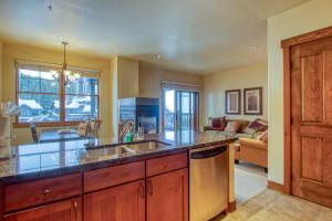 a kitchen with a sink and a counter top at The Cache in West Village in Copper Mountain