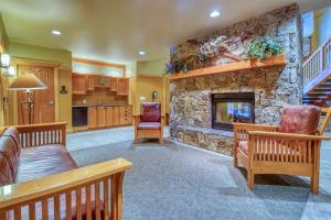 a large living room with a stone fireplace at Passage Point 422 in Copper Mountain
