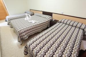 Postel nebo postele na pokoji v ubytování Hostal la Campana