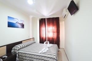 Postel nebo postele na pokoji v ubytování Hostal la Campana