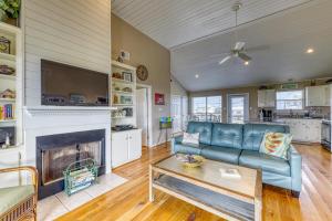 a living room with a couch and a fireplace at Just Chillin' in Dauphin Island