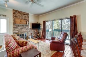 a living room with a couch and a fireplace at Okemo Trailside 6A in Ludlow