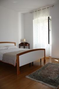 Giường trong phòng chung tại Apartments Villa Sandi