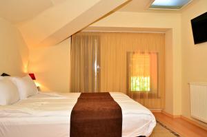 Ένα ή περισσότερα κρεβάτια σε δωμάτιο στο Family Hotel Maraya