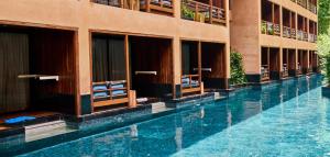 a swimming pool in front of a building at Avatar Railay in Railay Beach