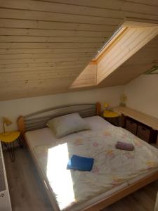 A bed or beds in a room at Chalupa Máša