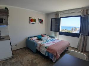 Postel nebo postele na pokoji v ubytování Casa Mykonos 1° linea de mar en Playa Blanca