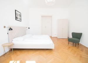 Łóżko lub łóżka w pokoju w obiekcie HeyMi Apartments Stadtpark
