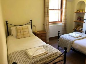 Letto o letti in una camera di Lazy Daze Cottage